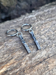 6th Anniversary cubic twist earrings with natural background