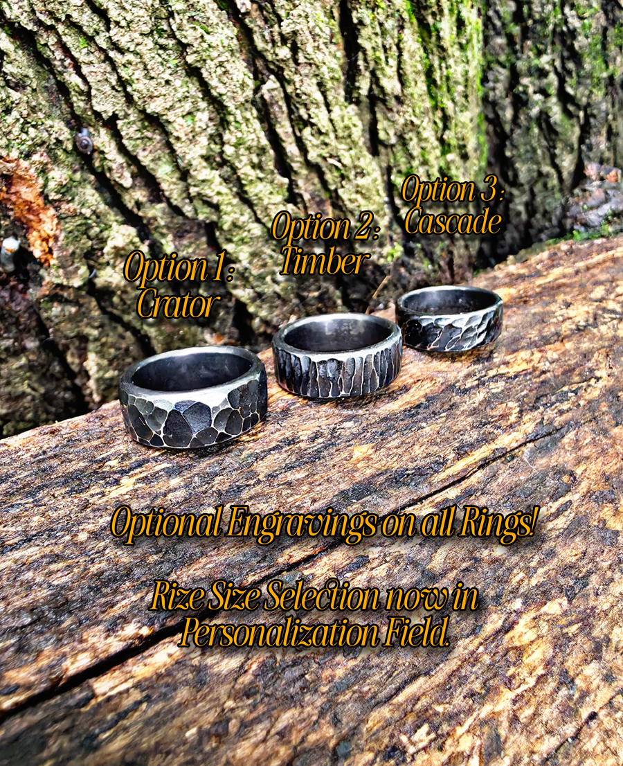 Three textured metal rings displayed on a weathered log in front of tree bark, with overlaid text showing ring options: Option 1 Crater, Option 2 Timber, Option 3 Cascade, and text noting optional engraving on all rings.