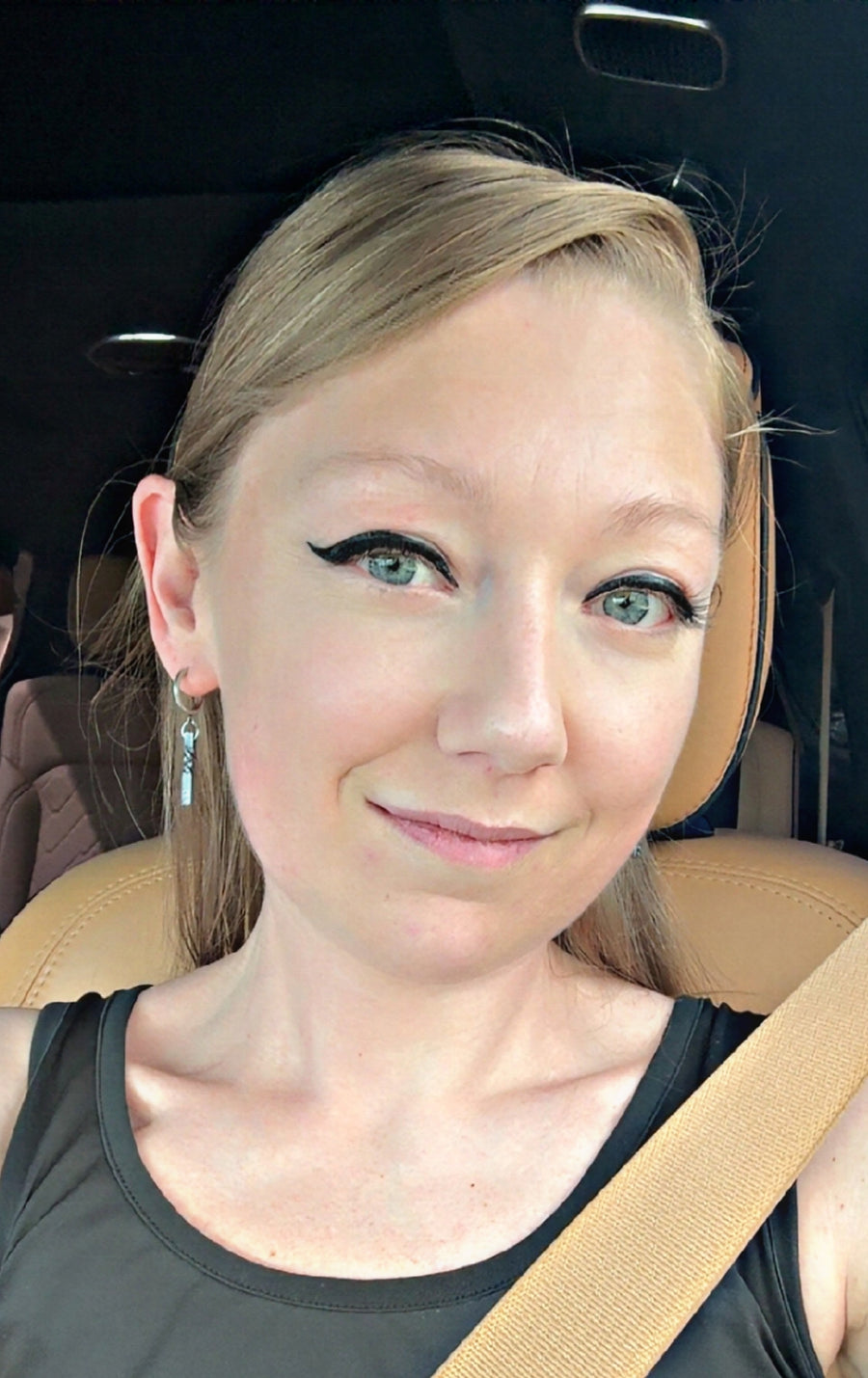 Cubic twist earrings shown on a model.